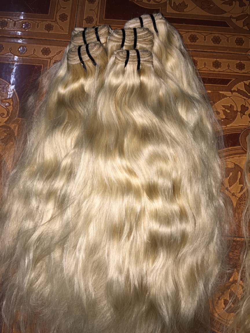 Blonde hair with a center part, back view
